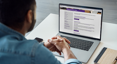 Student with laptop.